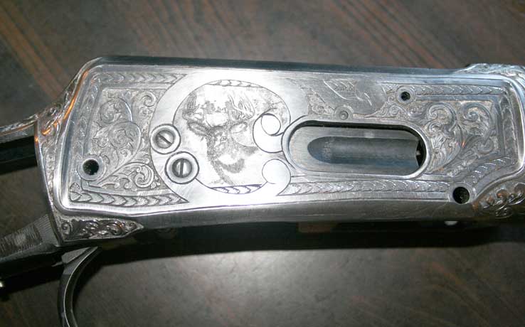 winchester with engraved deer